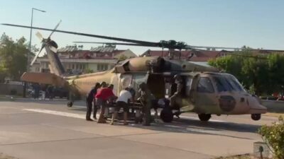 Muğla'nın Fethiye ilçesinde yamaç paraşütü yaptıkları sırada kayalıklara düşen, yamaç