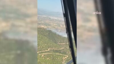İzmir'in Ödemiş ilçesi Yeniköy Mahallesi'nde ormanlık alanda çıkan yangın, ekiplerin