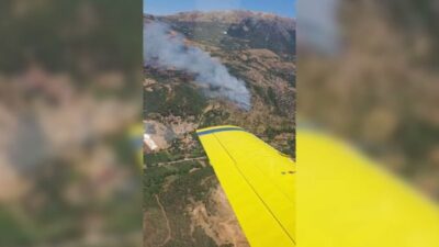 İzmir'in Kiraz ilçesi Ören Mahallesi’nde ziraat arazisinde başlayan yangın, ormanlık
