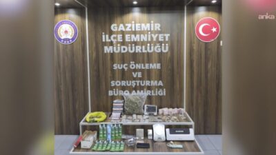 İzmir'in Gaziemir ilçesinde polisin belirlenen araçlar ile bir adrese düzenlediği